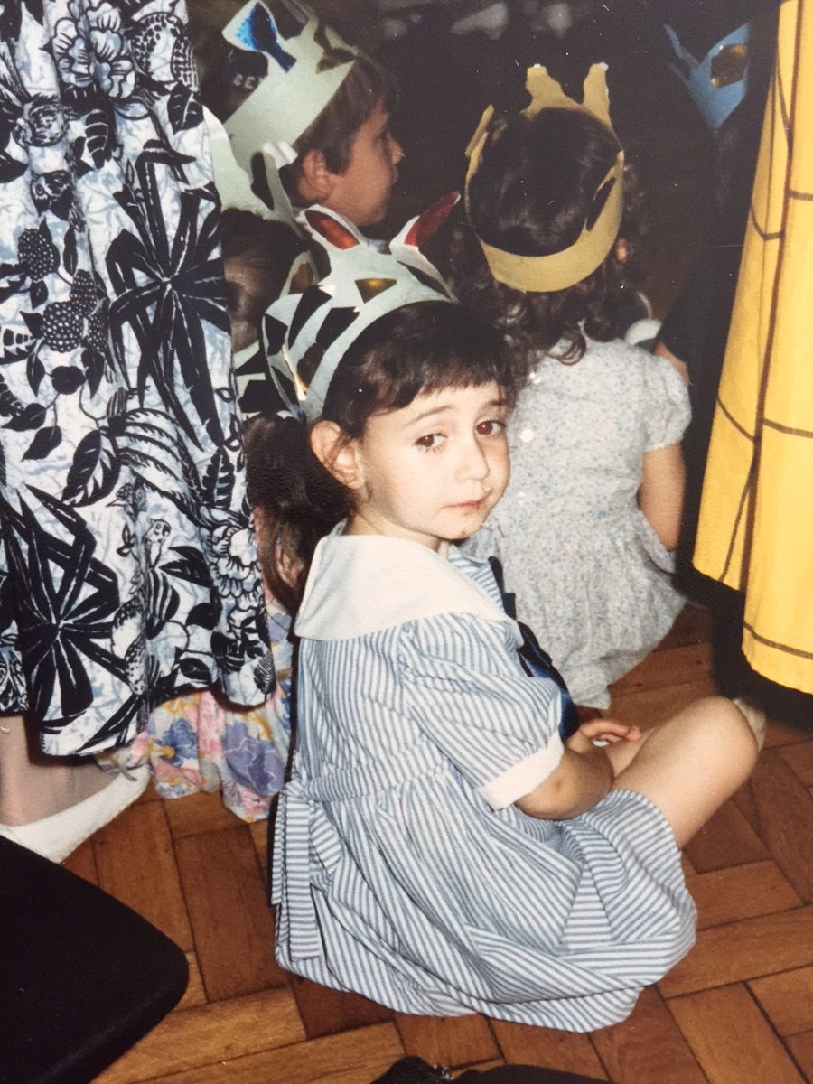 Lauren as a little girl, wearing a crown